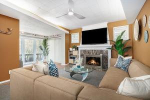a living room with a couch and a fireplace at The Townline House in Union Pier