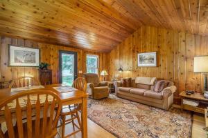 a living room with a couch and a table at Serenity in Honor