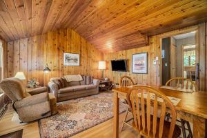 a living room with a couch and a table at Serenity in Honor