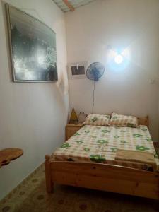 a bedroom with a bed in a room at Cafe Romantique - Landhouse Style in Mérina