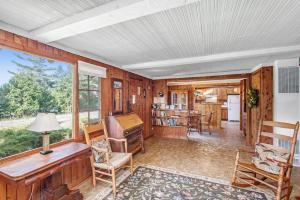a living room with a desk and a table at Cedar Cot & Cedar Tot in Beulah