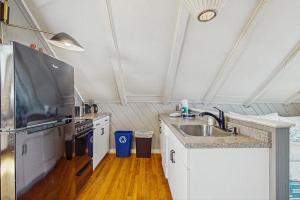 a kitchen with a sink and a stove at Monument View in Provincetown
