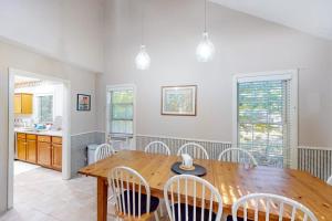a dining room with a wooden table and chairs at Lou n' Lil's in Glen Arbor