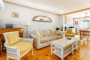 a living room with a couch and a table at Hammock Hideaway in Mashpee