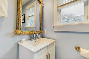 a bathroom with a sink and a mirror at Provincetown Waterfront Studio in Provincetown +7 photos