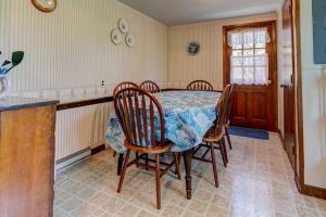 a dining room table and chairs in a kitchen at Nauset Beach Dream in Orleans +18 photos