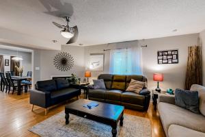 a living room with two couches and a table at Seafarer 7 in Ocean Pines