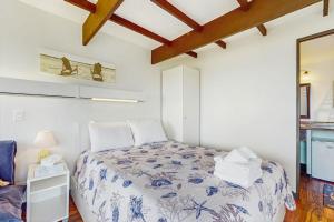 a bedroom with a bed in a room at Seashore Escape in North Truro +7 photos