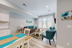 a kitchen and a living room with a dining room at Cozy TC Bay Condo in Traverse City