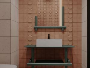 a bathroom with a toilet and a shelf with a sink at TRIBE Strasbourg Centre Gare in Strasbourg