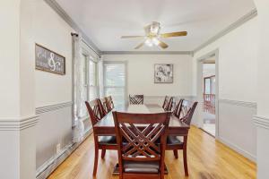 a dining room with a table and chairs at Charlotte’s Chateau in New Buffalo