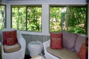 a living room with two couches and two windows at Hal-Sea-On House in Glen Arbor +32 photos