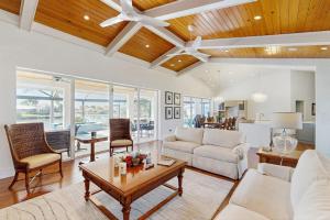 a living room with a couch and a table at Dock Holiday in Marco Island