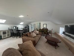 a living room with a couch and a table at New Drovers in Llanelli