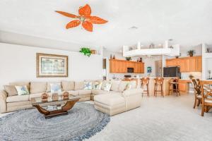 a living room with a couch and a table at Cape Coral Haven in Cape Coral