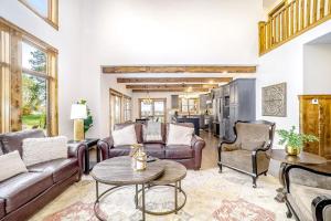 a living room with couches and a table at Buckaroo in Thompsonville
