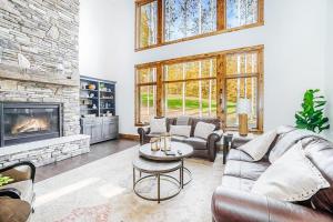 a living room with a couch and a fireplace at Buckaroo in Thompsonville