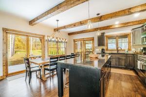 a kitchen with a table and chairs and a dining room at Buckaroo in Thompsonville +41 photos