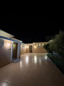 an empty garage at night with lights on it at بستان الورد 2 in Taif