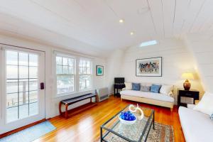 a living room with a couch and a table at The Lighthouse in Provincetown