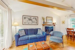 a blue couch and a chair in a living room at Lake Michigan Adventures in Lakeside