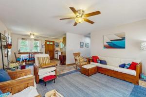 a living room with a couch and a ceiling fan at Old Orchard in Edgartown