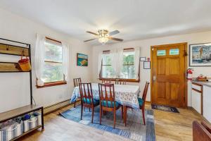 a dining room with a table and chairs at Old Orchard in Edgartown