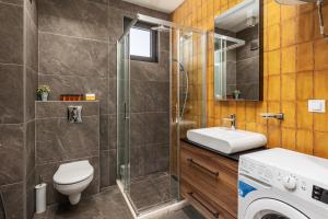 a bathroom with a toilet sink and a shower at XIO Apartments in Bar +57 photos