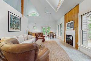 a living room with a couch and a fireplace at The Lemonade Stand in West Tisbury