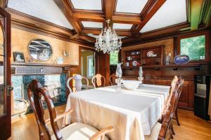 a dining room with a table and a chandelier at Lake Michigan Retreat- Upper Duplex in Benton Harbor +45 photos