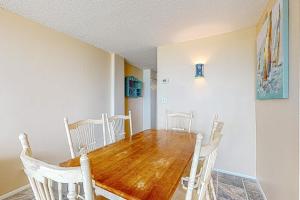 a dining room with a wooden table and chairs at Sea Colony --- 1BB Brandywine Garden in Bethany Beach