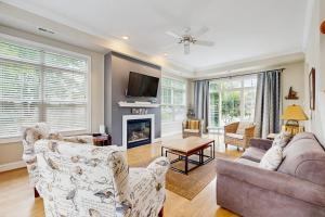 a living room with two couches and a fireplace at Beacon Court Condo F in Douglas