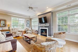 a living room with a couch and a fireplace at Beacon Court Condo F in Douglas