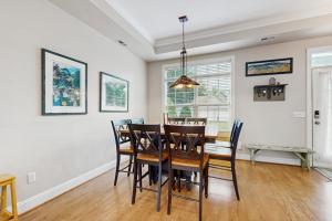 a dining room with a table and chairs at Beacon Court Condo F in Douglas