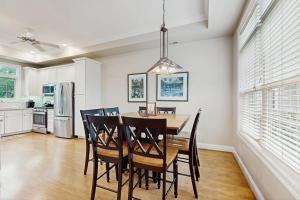 a dining room with a table and chairs at Beacon Court Condo F in Douglas