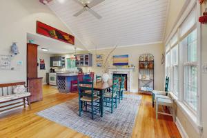 a kitchen with a table and chairs in a room at Happy Thoughts Cottage in New Buffalo +16 photos
