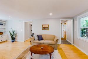 a living room with a couch and a coffee table at Private Pocasset Getaway in Pocasset