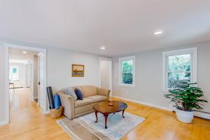 a living room with a couch and a table at Private Pocasset Getaway in Pocasset +26 photos