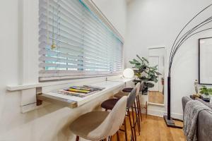 a dining room with a table and chairs and a window at Arrowhead Resort - Undeniably Darling in Saugatuck
