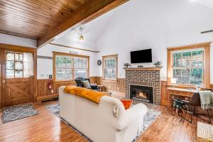 a living room with a couch and a fireplace at Cedar Nook in Arcadia