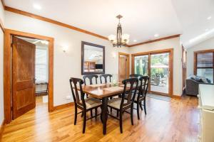 a dining room with a table and chairs at Coast Away in Union Pier