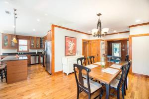 a kitchen and dining room with a table and chairs at Coast Away in Union Pier