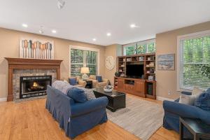 a living room with a couch and a fireplace at The Oasis at Forest Beach in New Buffalo