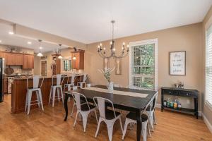 a kitchen and dining room with a table and chairs at The Oasis at Forest Beach in New Buffalo