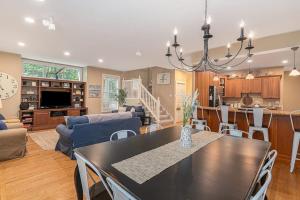 a dining room and living room with a dining table at The Oasis at Forest Beach in New Buffalo +33 photos