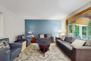 a living room with a couch and a table at Red Arrow Lodge in Sawyer