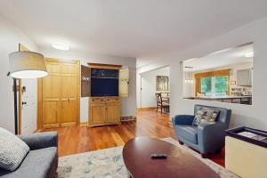 a living room with a couch and a table at Red Arrow Lodge in Sawyer