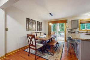 a dining room with a wooden table and chairs at Red Arrow Lodge in Sawyer