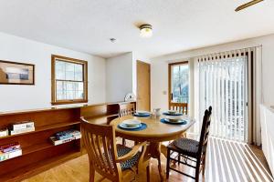 a kitchen and dining room with a table and chairs at Eastham Glen in Eastham