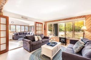 a living room with couches and a table at Generations in Douglas